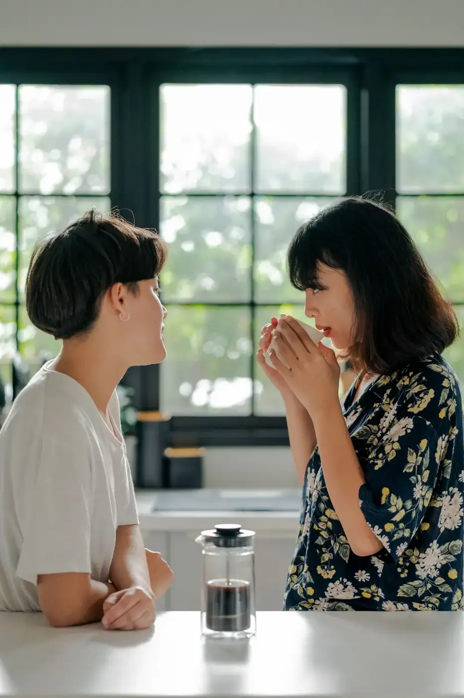 Couple enjoying coffee in their kitchen